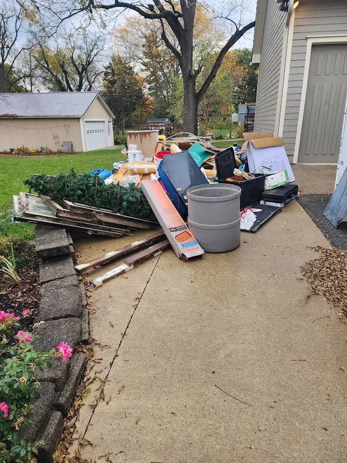 Dumpster being loaded with debris for Residential Dumpster Rental in Todd Creek